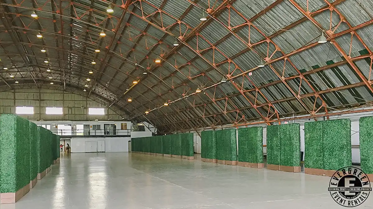Artificial hedge wall installation at Santa Monica Wine Festival in Barker Hangar